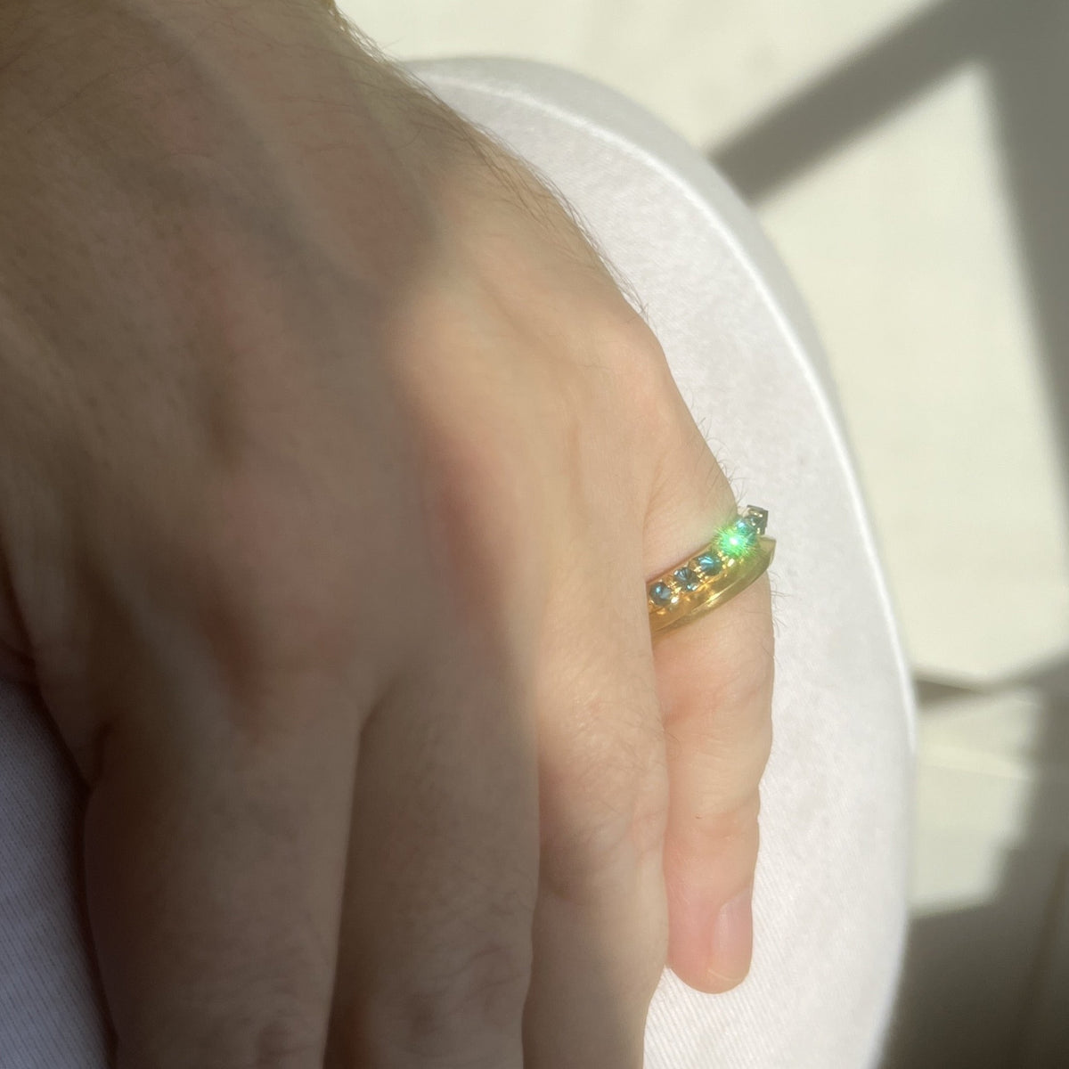 Makhaira band and Barbed diamond eternity rings stacked on models little finger