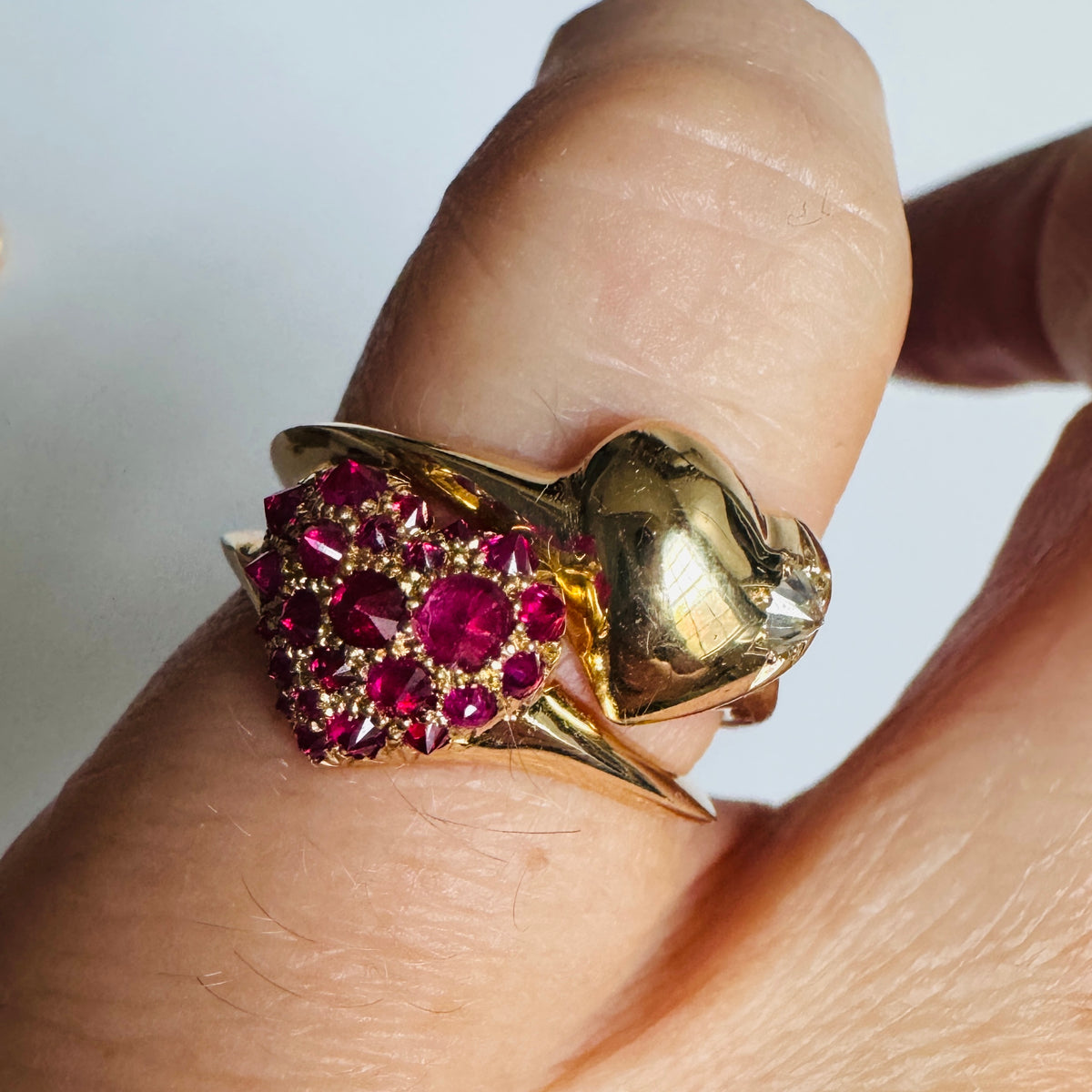gold and pavé ruby heart shaped signet ring stacked with gold and diamond heart shaped signet ring by Tamsin Rasor shown on models pinky finger