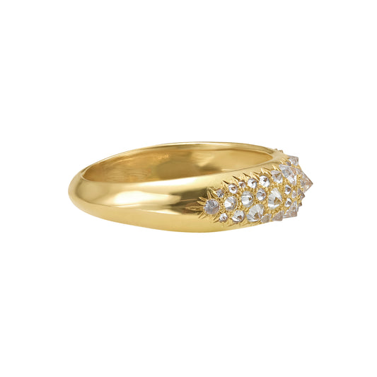 side view of 18K yellow gold and spiked white diamond dome ring by Tamsin Rasor, on white background