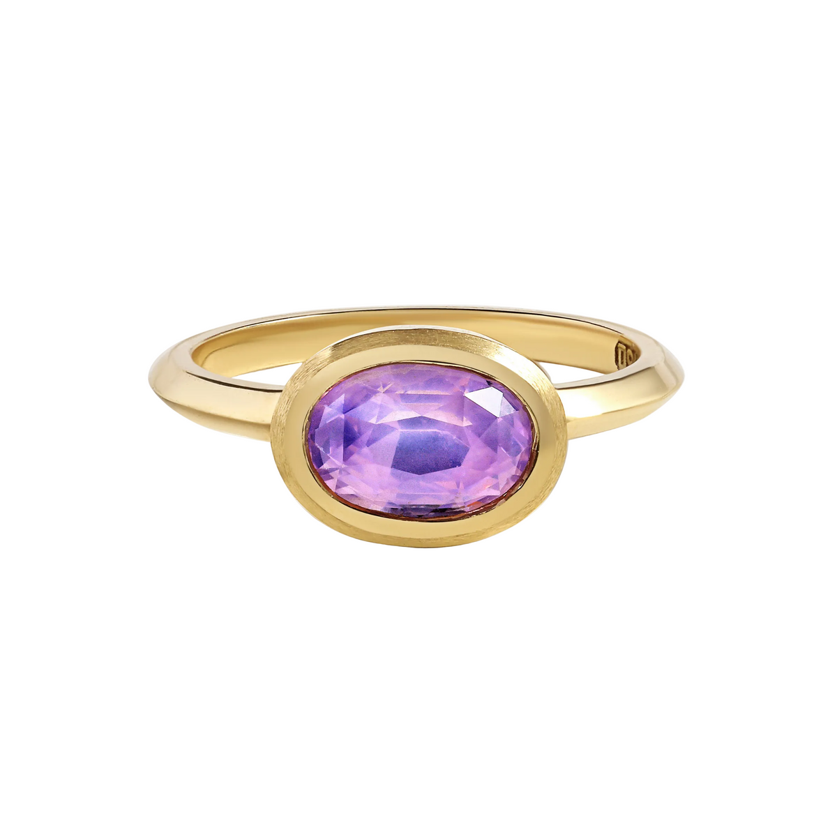 Gold ring with a purple sapphire gemstone  by Tamsin Rasor on a white background