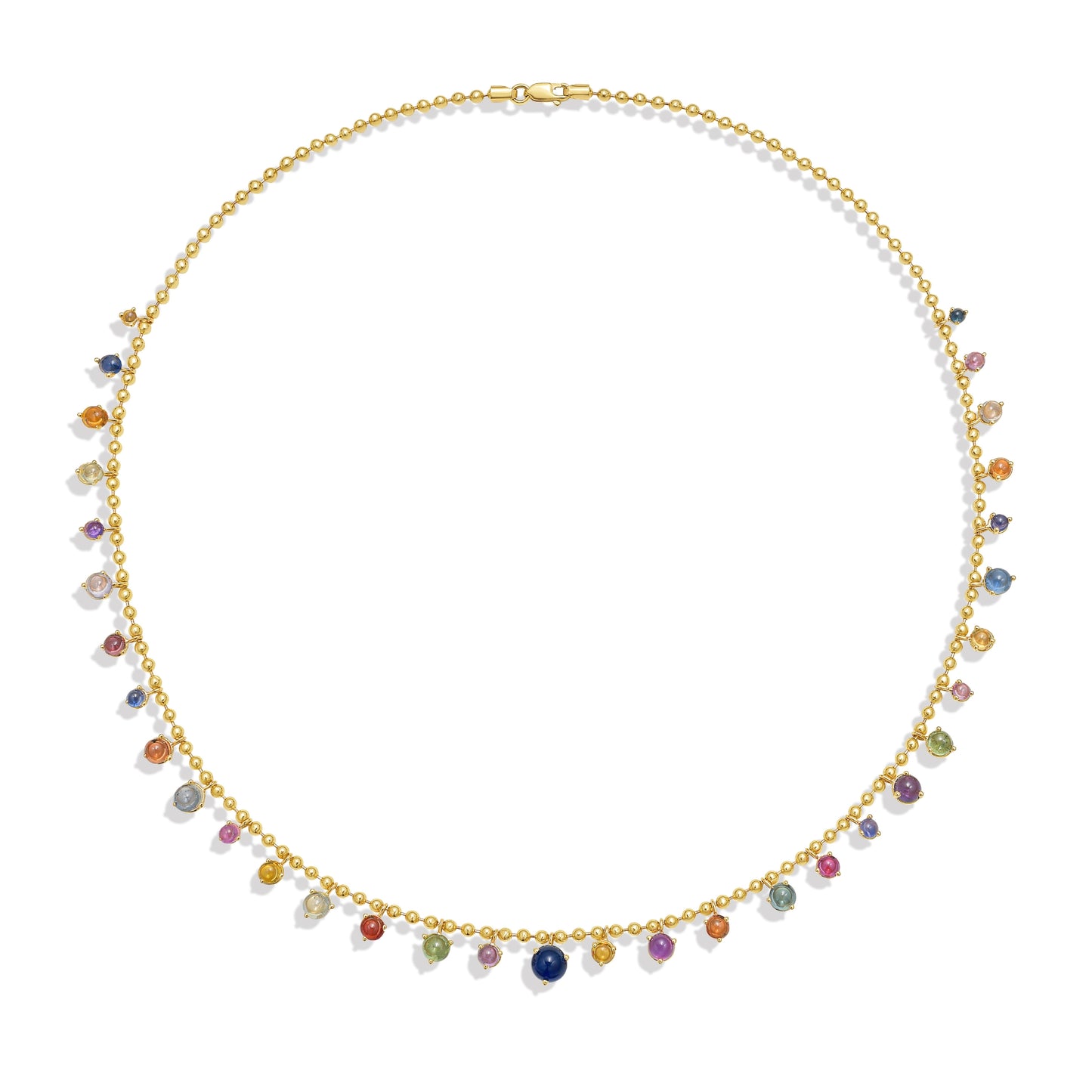 A gold bead chain necklace featuring a fringe of multi color sapphire cabochon gem drops, set in gold prong settings, arranged in a gentle curve against a white background with a soft shadow. By Tamsin Rasor