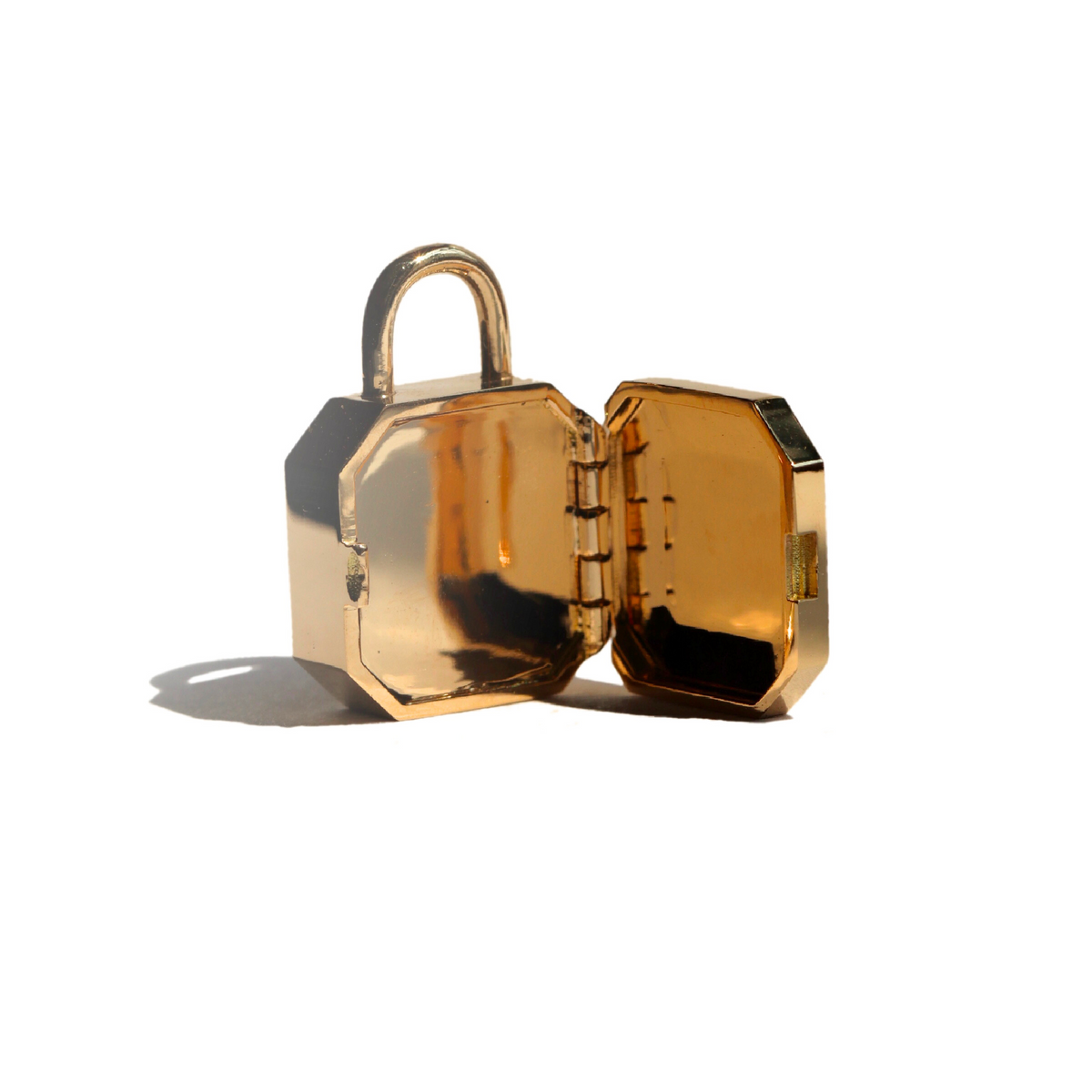 Gold padlock inspired locket pendant shown open on a white background by Tamsin Rasor fine Jewelry