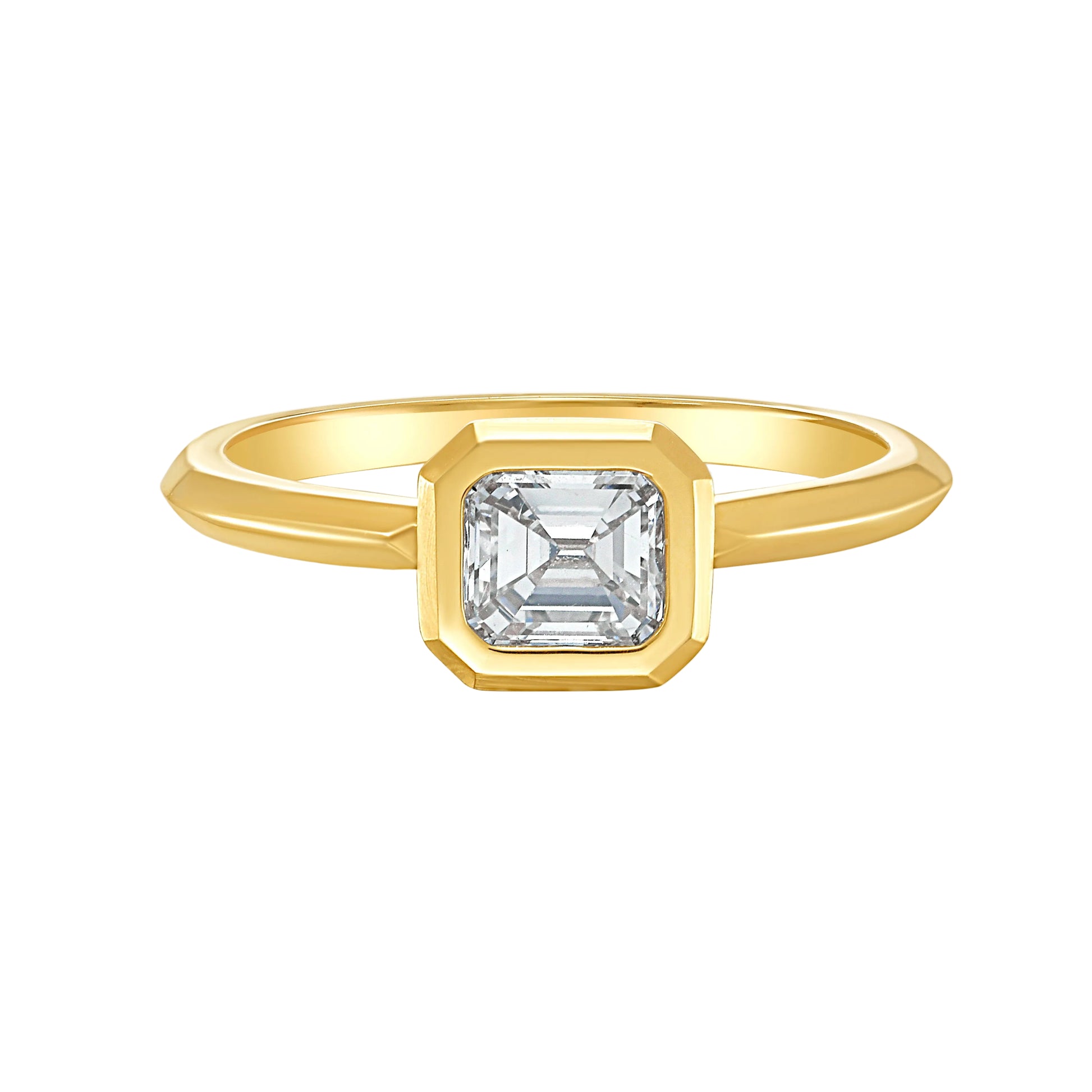 Gold bezel set solitaire ring with an Asscher white diamond by Tamsin Rasor, on a white background