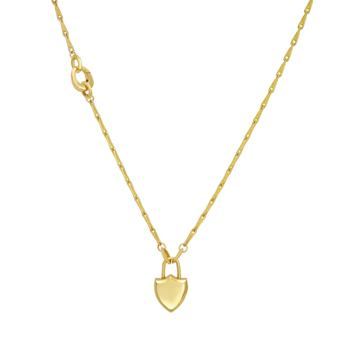 A gold necklace with clip bail detail,  featuring a small shield-shaped pendant with a lock detail, suspended from a delicate gold chain on a plain white background.