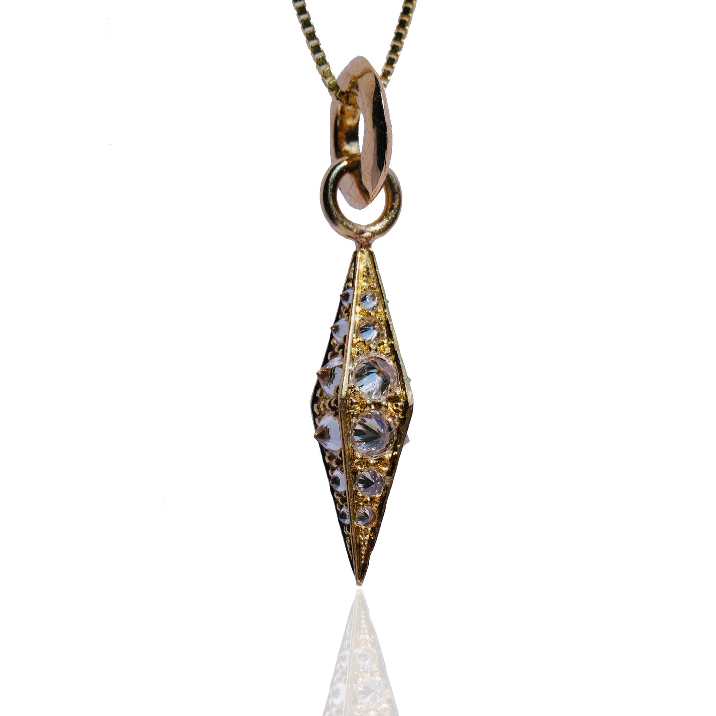 barbed diamond obelisk pendant on chain against a white background