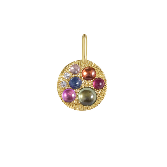 Gold pendant with multicolored cabochon sapphires and inverted white diamonds on a white background, by Tamsin Rasor