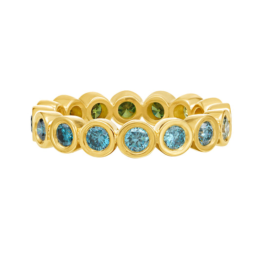 Blue and Green ombré color diamond eternity ring in yellow gold bezel setting, by Tamsin Rasor on white background