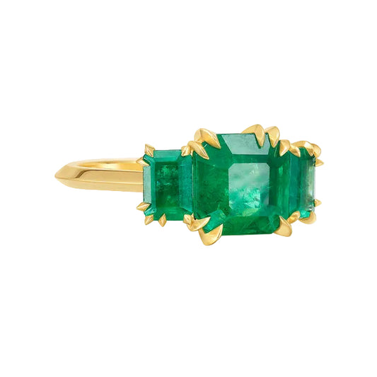 Gold and three stone emerald Trilogy ring by Tamsin Rasor white background