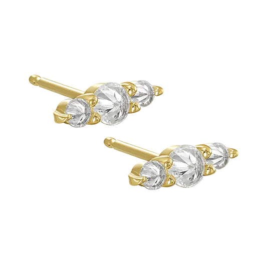 Gold and white diamond three stone stud earrings on a white background
