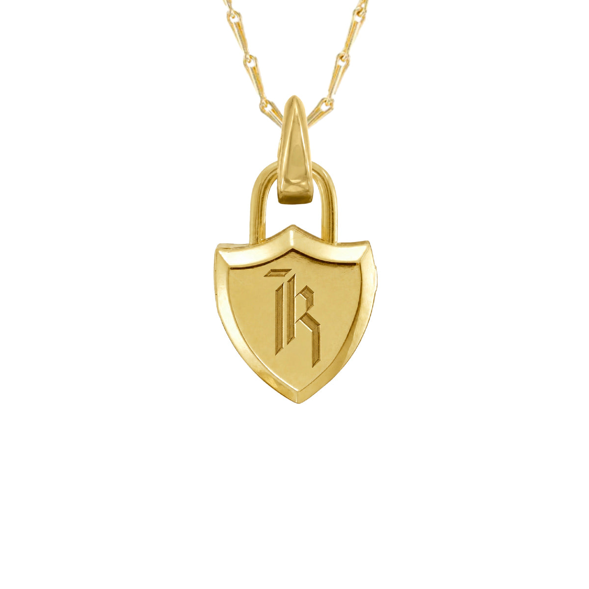 A polished gold shield-shaped locket pendant charm on a gold chain featuring an engraved stylized 'K' initial, suspended from a gold clip bail, shown on a plain white background.