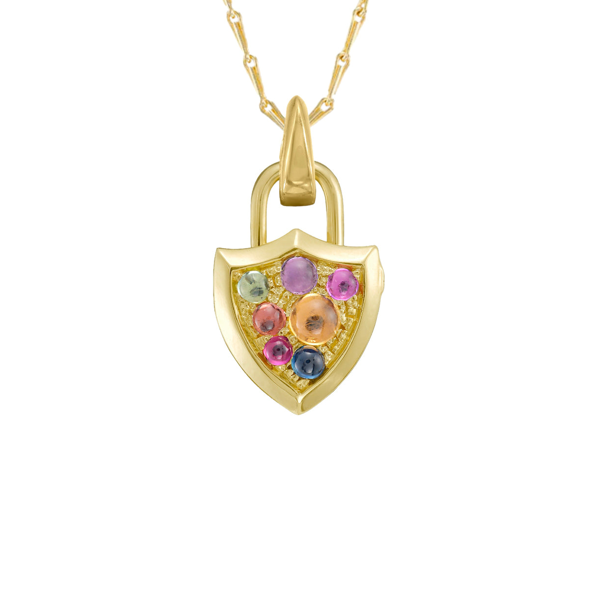A gold shield-shaped padlock inspired locket pendant on gold chain. The front of the locket is covered in small,  multicolored  cabochon gemstones in pink, purple, blue, and green, set against a plain white background. By Tamsin Rasor