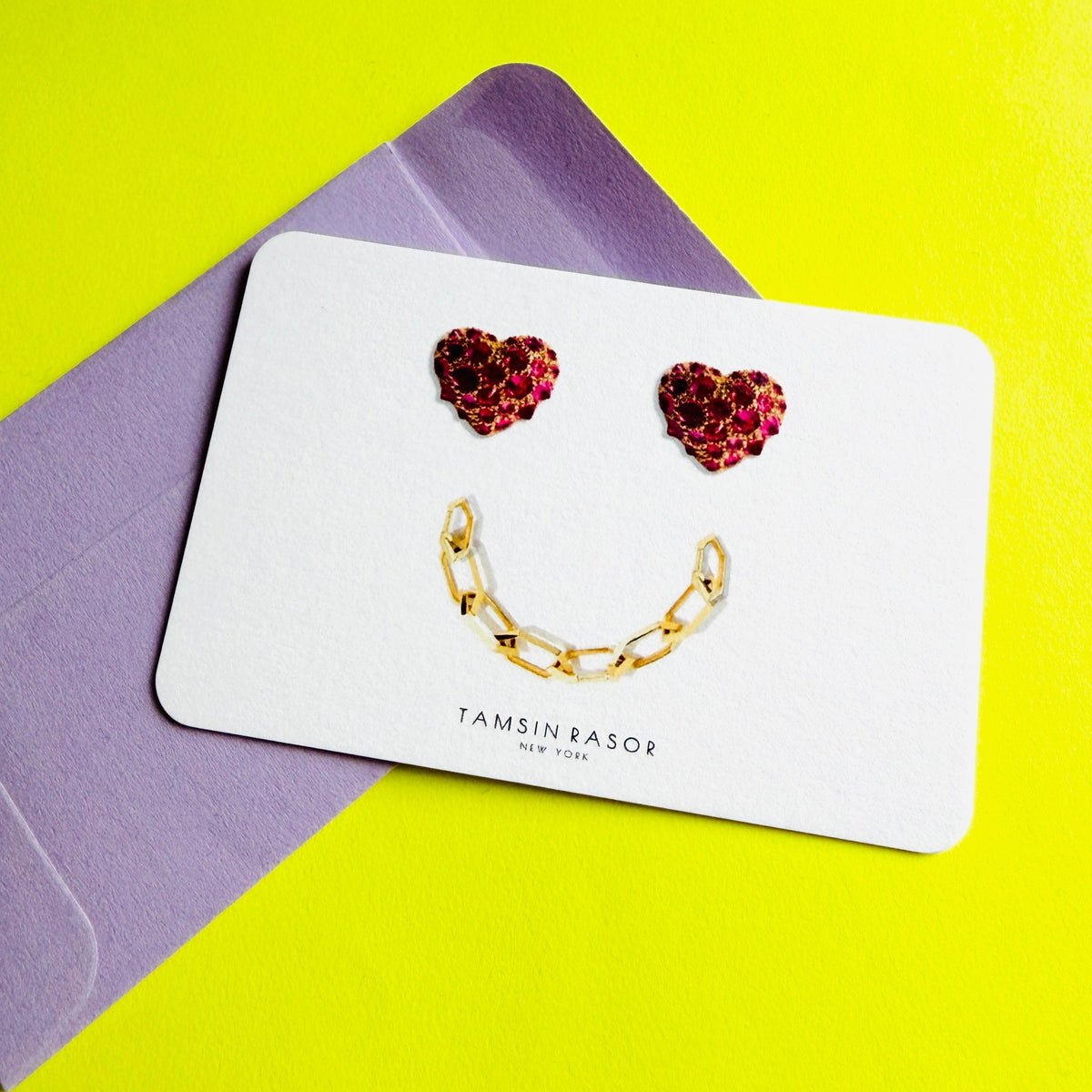 Tamsin Rasor Gift Card with purple envelope on neon yellow background