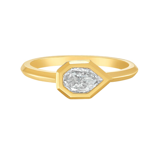 Gold ring with an empress cut white diamond on a white background by Tamsin Rasor