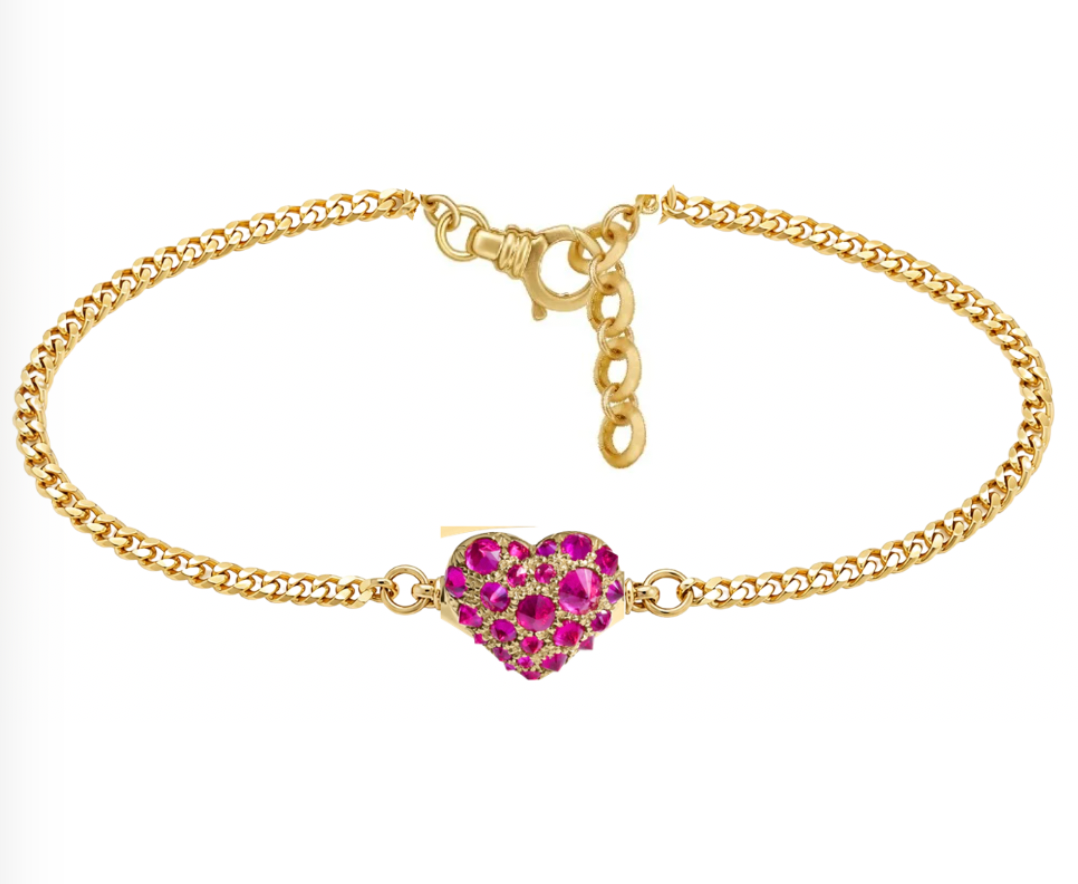 Gold bracelet with a heart-shaped ruby charm by Tamsin Rasor shown white background