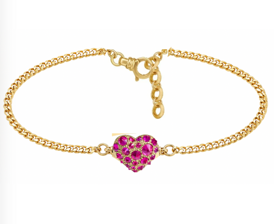 Gold bracelet with a heart-shaped ruby charm by Tamsin Rasor shown white background