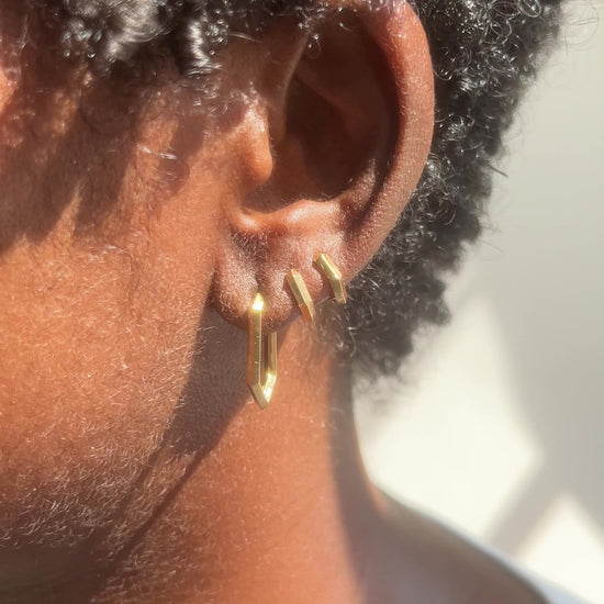 close up video of makhaira hoop earrings on models ear